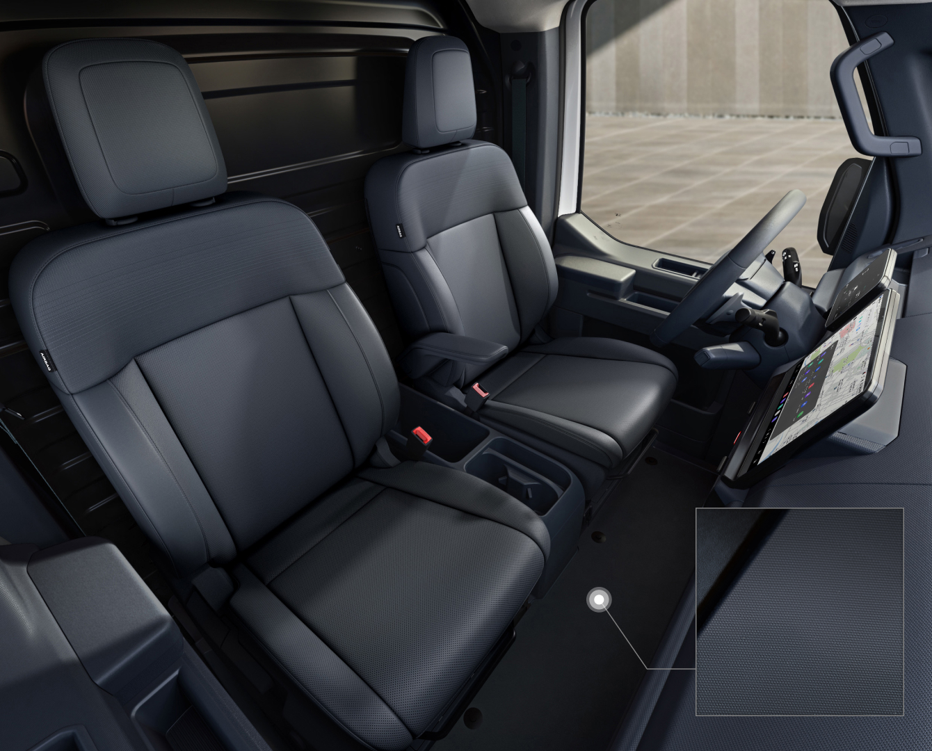 Close-up of the Kia PV5 Cargo interior floor with durable carpeting