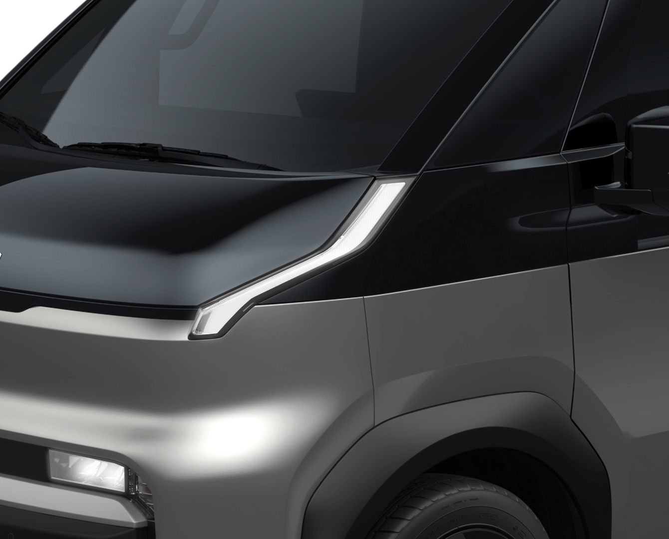 Close-up of the Kia PV5 Cargo front headlight and hood design