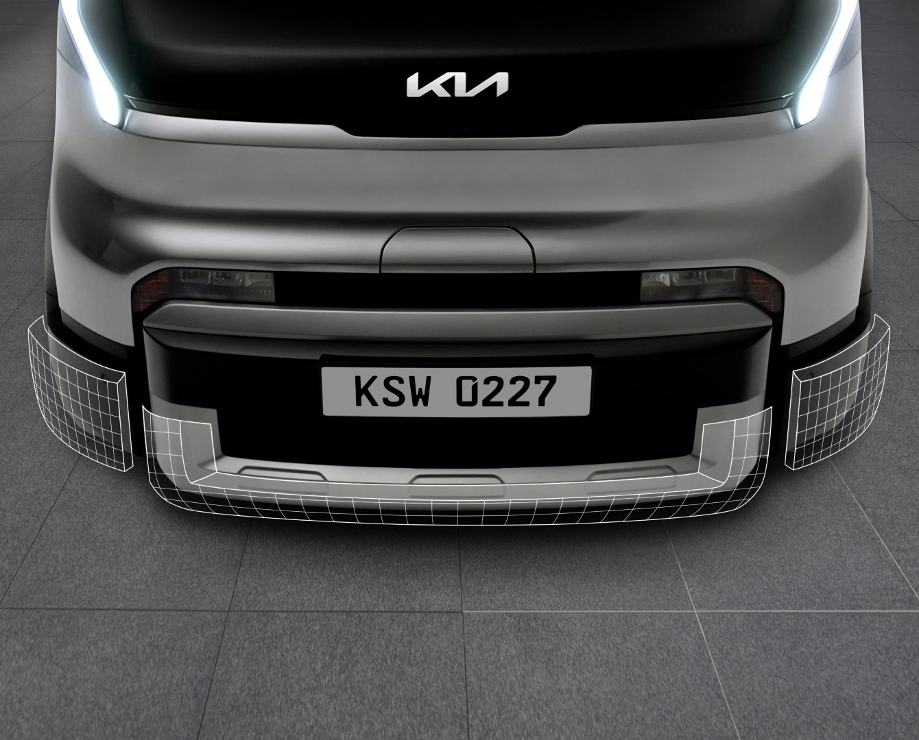 Close-up of the Kia PV5 Cargo front bumper and lower grille