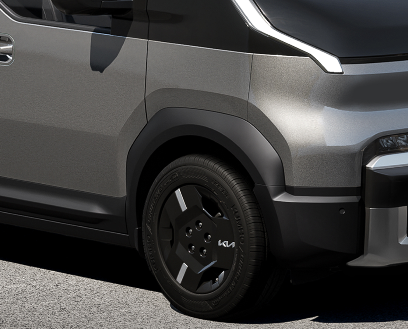 Close-up of the Kia PV5 Cargo right rear wheel and fender