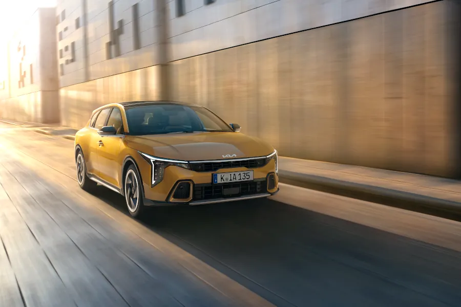 Kia K4 honeycomb yellow front driving view