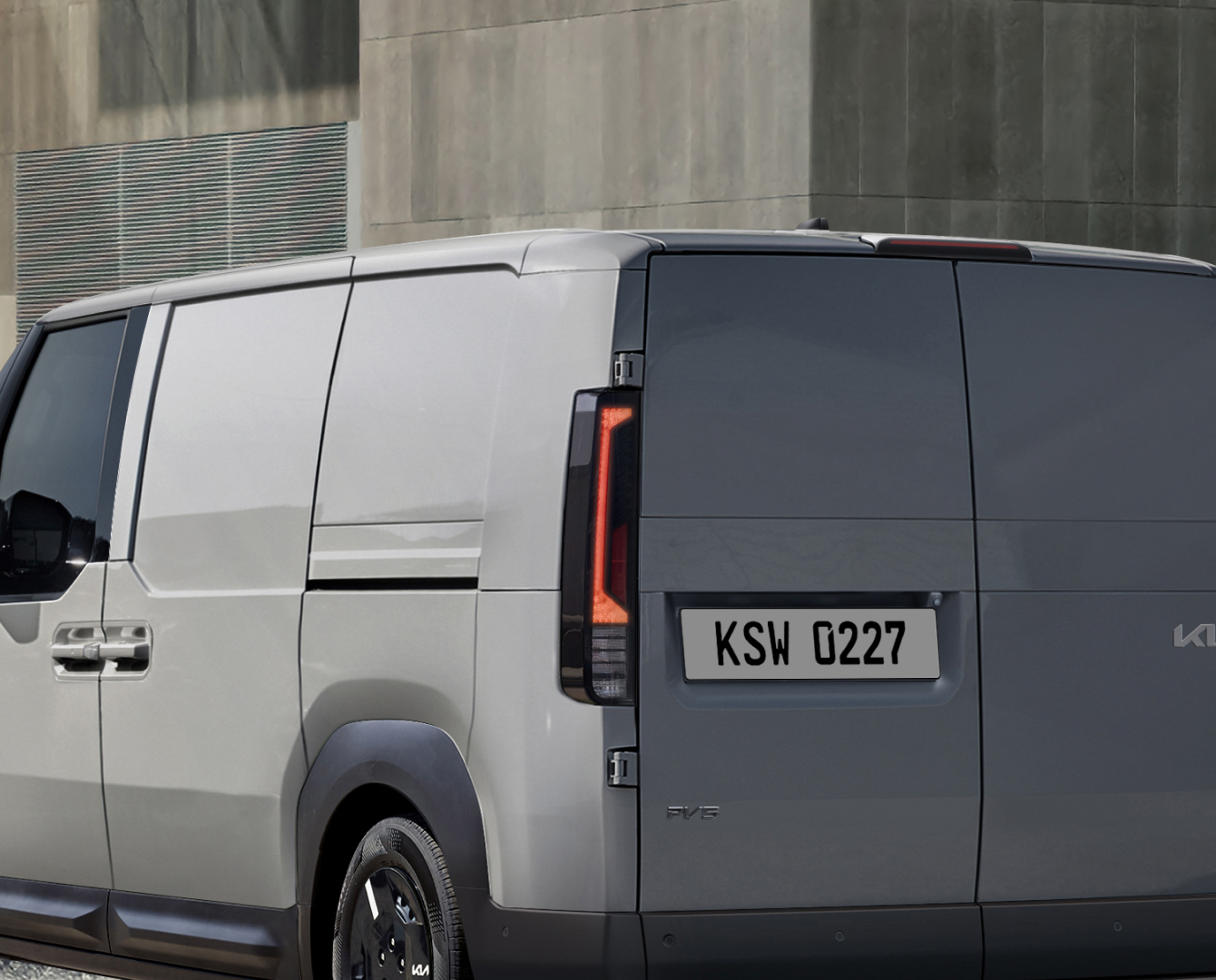 Rear-side view of the Kia PV5 Cargo with rear lamp visible